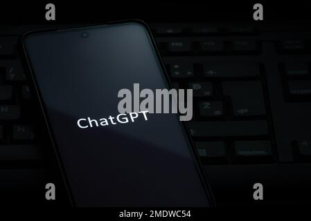 Ljubljana, Slovenia - 21 January 2023: ChatGPT logo on smartphone screen laying on computer keyboard Stock Photo