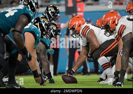 The Cleveland Browns offense and the Jacksonville Jaguars defense line up  at the line of scrimmage during the first half of a preseason NFL football  game, Friday, Aug. 12, 2022, in Jacksonville