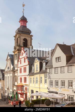 Steinernes Haus, and the Catholic Church of the Assumption of Mary, Old Market, Hachenburg, Westerwaldkreis in Rhineland-Palatinate, Germany Stock Photo