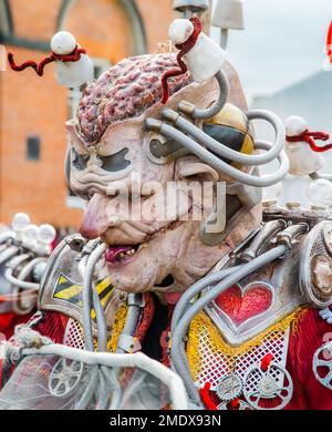 https://l450v.alamy.com/450v/2mdx93n/close-up-of-a-scary-gnarly-looking-alien-or-mutant-character-with-his-brain-showing-and-a-scarred-face-wearing-futuristic-clothing-2mdx93n.jpg