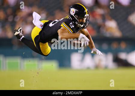 Pittsburgh Steelers' Cody White (15) is hit after making a catch