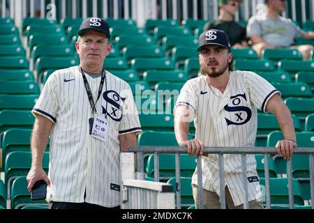 Chicago White Sox fans watch batting practice before a baseball game  against the New York Yankees, Thursday, Aug. 12, 2021 in Dyersville, Iowa.  The Yankees and White Sox are playing at a