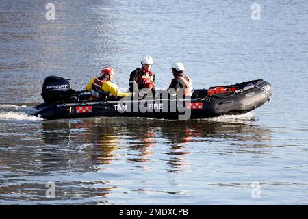 Fire boat, inflatable motor boat, and crew, Cardiff Bay taken January 2023 Stock Photo