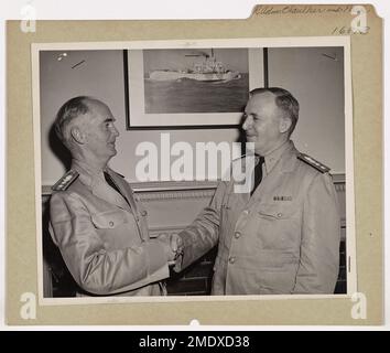 Rear Admiral Charles A. Park is congratulated by Rear Admiral Lloyd T. Chalker. Rear Admiral Charles A. Park, right, Chief of Operations, U. S. Coast Guard, promoted from the rank of captain, is congratulated by Rear Admiral Lloyd T. Chalker, Assistant Commandant, U.S. Coast Guard, at Coast Guard Headquarters, Washington, D.C. Admiral Park was born in New Lexington, Ohio. He served as superintendent of lighthouses in Detroit, Michigan, for 22 years and was assigned to Washington in 1932 as chief engineer of the lighthouse service. Admiral and Mrs. Park reside at 5126 Nebraska Avenue, N.W., Was Stock Photo