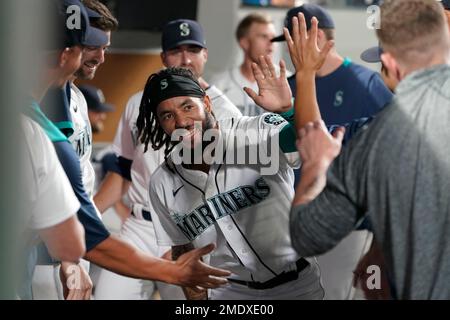 Seattle Mariners' J.P. Crawford (3) is greeted by Ty France after Crawford  scored in the eighth inning of the team's baseball game against the Los  Angeles Angels, Friday, April 30, 2021, in