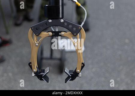 Close-up on sapper robotic arm manipulator, part of military bomb disposal robot for safe relocation of bombs and mines Stock Photo