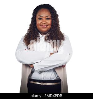 Proud, portrait and business woman in studio, empowered and confident on white background. Face, leader and black woman standing in power, ambition Stock Photo