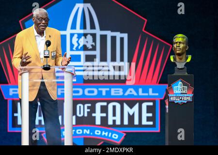 Harold Carmichael, left, a member of the Pro Football Hall of Fame  Centennial Class reacts after unveiling his bust beside his presenter James  Solano during the induction ceremony at the Pro Football