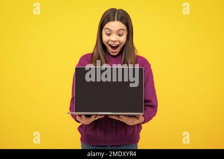 Excited face. Amazed teenager. School student using laptop. E-learning and online education. Teen girl on internet video chat isolated on isoalted Stock Photo