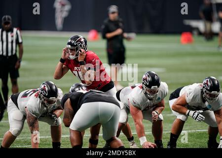 Atlanta Falcons quarterback Feleipe Franks (15) is tackled by Miami  Dolphins defensive end Jason Strowbridge (58) and linebacker Sam Eguavoen  (49), during the second half of a preseason NFL football game, Saturday