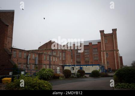 An exterior view of buildings within the precincts of HMP Liverpool, also known as Walton Prison. The prison was given a scathing report in 2017 which pointed out various failings and problems. Present governor Pia Sinha was appointed in that year and in the next two years she turned the prison around with a programme of improvements and support for inmates and infrastructure. HMP Liverpool houses a maximum of 700 prisoners with an overall staff of around 250. Stock Photo