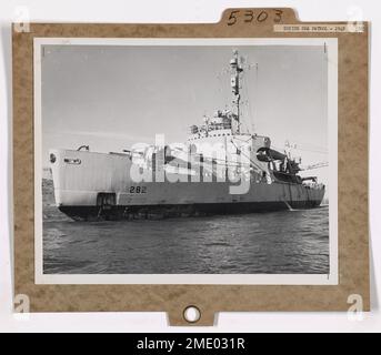 United States Coast Guard Bering Sea Patrol - Cutter NORTHWIND, Aleutians. USCGC NORTHWIND anchored at Unga, in the Aleutians. The NORTHWIND, veteran of polar regions, spearhead of both 'Operation Nanook' and 'Operation High Jump' made the Bering Sea Patrol of 1948. Stock Photo