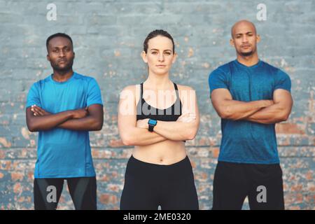 Be serious about exercise like youre serious about food. three sportspeople standing together. Stock Photo