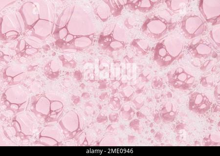 Skin care soap bubbles on pink background background texture. Full frame Stock Photo