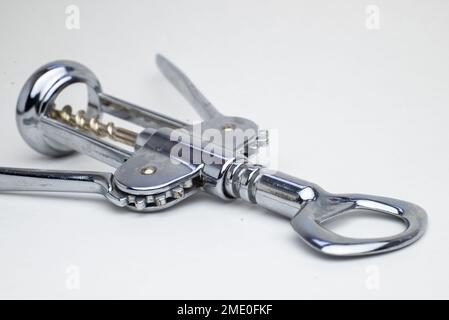 shiny metal wine bottle openers on a white background corkscrew. Stock Photo