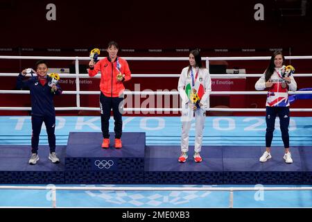 Japan's Sena Irie, Second From Left, Looks Up As She Holds Her Gold ...