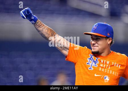 New York Mets' Javier Baez is congratulated by teammates after he