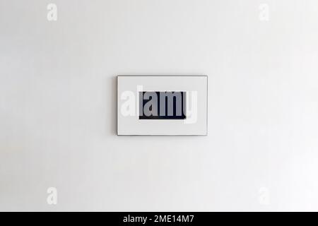 Intercom screen on the white wall Stock Photo