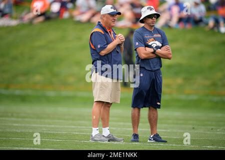 Denver, Colorado, USA. 7th Aug, 2021. Denver Broncos Head Coach VIC FANGIO,  center, looks on at his team as they stretch duringTraining Camp at UC  Health Training Center in Dove Valley Sat.