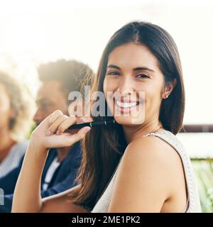 We achieve greatness every day no matter where we are. Portrait of a young businesswoman having a meeting with her colleagues outdoors. Stock Photo