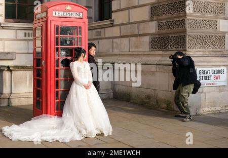 Girl in phone booth Stock Photos - Page 1 : Masterfile