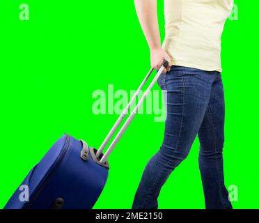 woman walking travel bag over isolated cutout on green background with chroma key Stock Photo