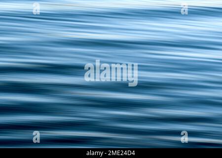 Abstract pattern formed by flowing water with slow shutter used to blur motion. Copy space. Backgrounds. No people. Stock Photo