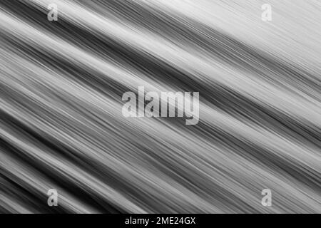 Abstract pattern in black and white formed by flowing water with slow shutter used to blur motion. Copy space. Backgrounds. No people. Stock Photo