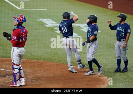 Seattle Mariners' Jarred Kelenic, right, celebrates with Abraham