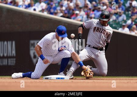 Arizona Diamondbacks' Eduardo Escobar, right, slides safely into