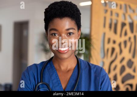 Portrait of happy female african american doctor with stethoscope Stock Photo