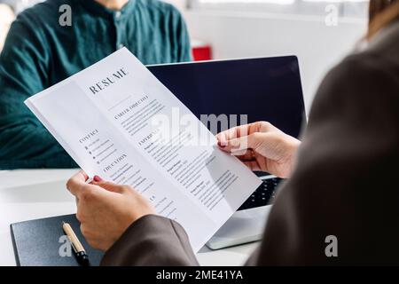 Man holding resume and stamp with Approved. Happy man got a job