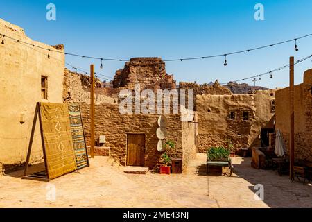 Saudi Arabia, Al-Ula, String lights hanging between mud houses in desert old town Stock Photo