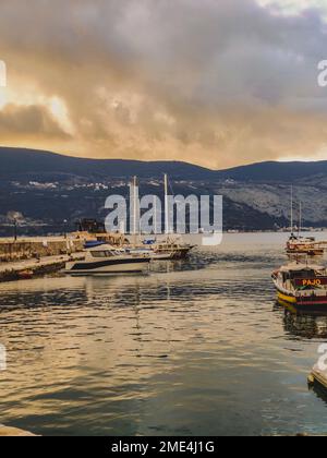 A vertical shot of boats parked at the dock on clear sky background in ...