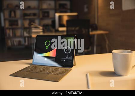 Tablet PC with smart home dashboard on screen Stock Photo