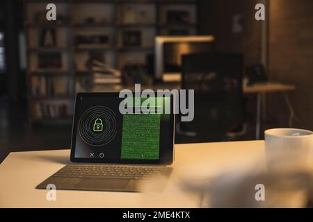Tablet PC with security system and data on screen in office Stock Photo