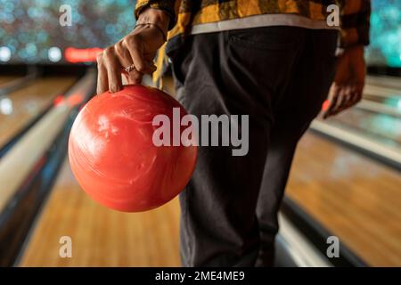 Man playing ten pin bowling Stock Photo