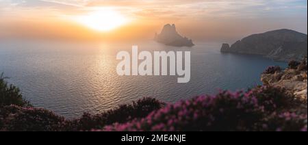 Spain, Balearic Islands, Panoramic view of Es Vedra island seen from clifftop at sunset Stock Photo