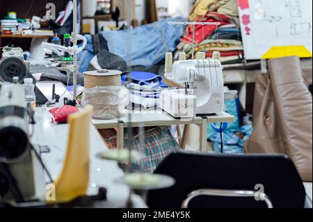 Work tools and machinery on table in workshop Stock Photo