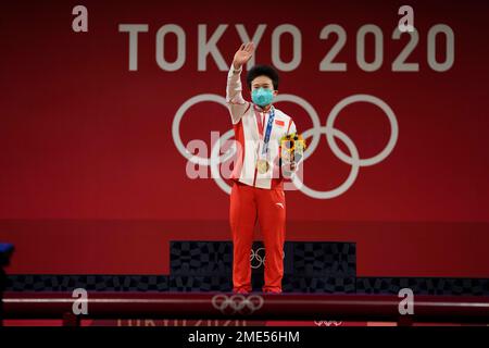 Hou Zhihui of China celebrates on the podium after winning the gold