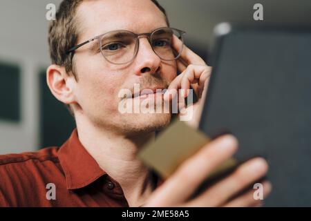 Businessman using tablet Computer at office Stock Photo