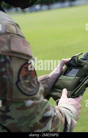 Staff Sgt. Richard Raynor, 374th Civil Engineer Squadron emergency management operations craftsman, uses a joint chemical agent detector to check for contaminants during a chemical, biological, radioactive and nuclear site survey training at the Sagami General Depot, Japan. This training integrated ANG members with active-duty Airmen to develop real-world job qualification skills. Stock Photo