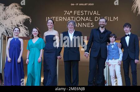 Anne-Sophie Bowen-Chatet, from left, Juliette Benveniste, Vicky Krieps, director Mathieu Amalric, Arieh Worthalter, Sacha Ardilly, and Aurele Grzesik pose for photographers upon arrival at the premiere of the film 'The Story of My Wife' at the 74th international film festival, Cannes, southern France, Wednesday, July 14, 2021. (AP Photo/Brynn Anderson)