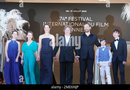 Anne-Sophie Bowen-Chatet, from left, Juliette Benveniste, Vicky Krieps, director Mathieu Amalric, Arieh Worthalter, Sacha Ardilly, and Aurele Grzesik pose for photographers upon arrival at the premiere of the film 'The Story of My Wife' at the 74th international film festival, Cannes, southern France, Wednesday, July 14, 2021. (AP Photo/Brynn Anderson)