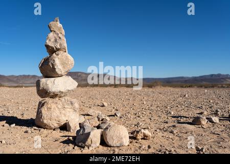 Stacked rocks on rocky ground Stock Photo