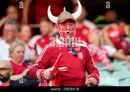 A Denmark team fan, his face in the colours of the Danish national flag, waits for the start of the Euro 2020 soccer championship quarterfinal match between Czech Republic and Denmark, at the Olympic stadium in Baku, Saturday, July 3, 2021. (AP Photo/Darko Vojinovic, Pool)