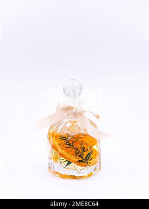 Reed diffuser with cinnamon and orange on white background Stock Photo
