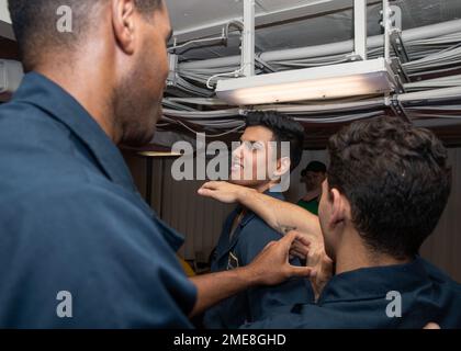 From left, a U.S. Airman teaches Major League Baseball players