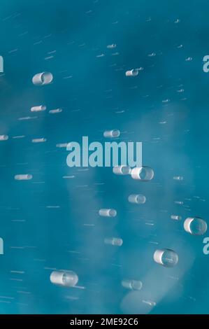Abstract colorful bubbles showing psychedelic motion blur with blue and white Stock Photo