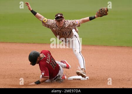 San Diego Padres second baseman Adam Frazier (12) runs to first base during  an MLB regular season game against the Los Angeles Dodgers, Wednesday, Sep  Stock Photo - Alamy